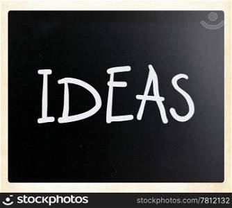 ""Ideas" handwritten with white chalk on a blackboard"