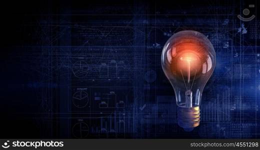 Ideas of financial growth. Conceptual image with light bulb on background of diagrams and graphs