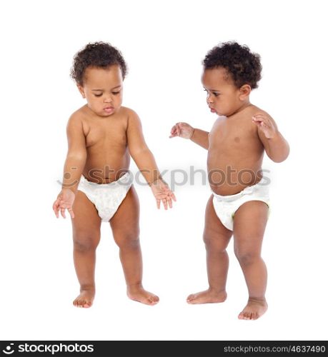 Identical babies twins in diaper isolated on a white background
