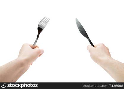 Idolated human hands with dinner equipments