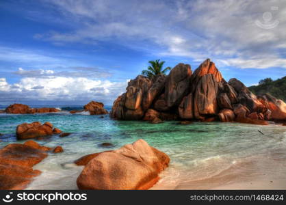 Idyllic beach with granitic rocks in Anse Cocos, La Digue island, Seychelles