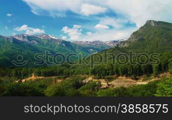 Idyllic landscape with clouds over mountaintops