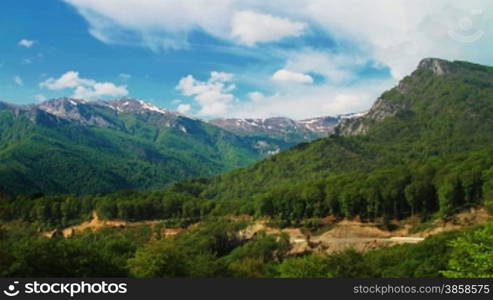 Idyllic landscape with clouds over mountaintops