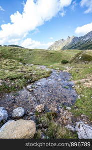 Idyllic little streamlet in the alps, mountain landscape