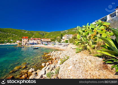 Idyllic mediterranean beach in Komiza village on Vis island, Dalmatia, Croatia