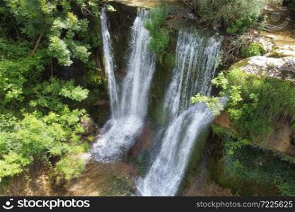 Idyllic rain forest waterfall, stream flowing in the lush green forest. High quality image.. Idyllic rain forest waterfall, stream flowing in the lush green forest.