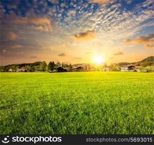 Idyllic rural scene of countryside meadow field on sunset, Germany