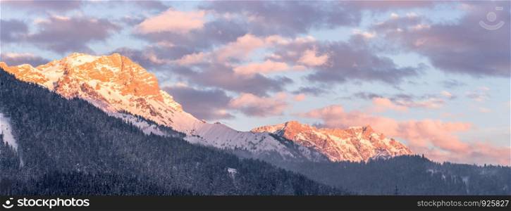 Idyllic scenery with snowy mountains in the evening sun, Alps, Austria