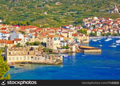 Idyllic town of Komiza on Vis island summer view, Dalmatia archipelago of Croatia