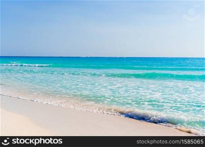 Idyllic tropical beach with white sand, turquoise ocean water and blue sky. Idyllic tropical beach with white sand, turquoise ocean water and blue sky on Caribbean island