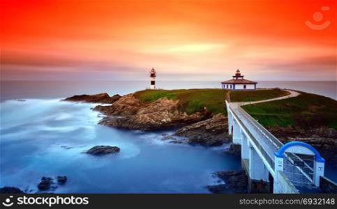 Idyllic view on seashore of Pancha island, Spain at sunset of red and orange colors