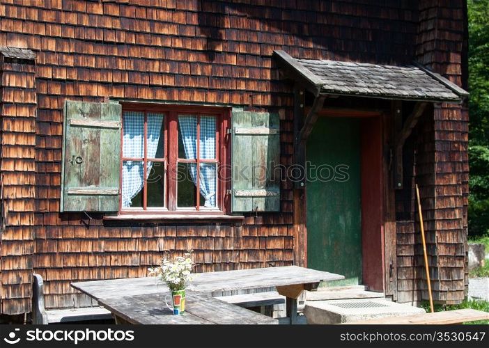 idyllic wood panelled alpine cottage in bavarian alps