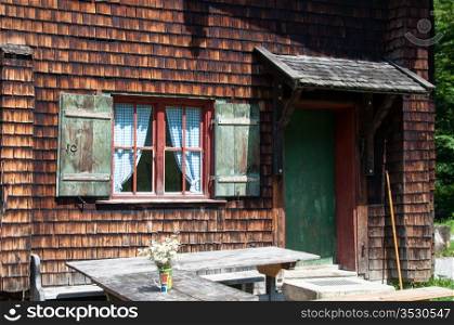 idyllic wood panelled alpine cottage in bavarian alps
