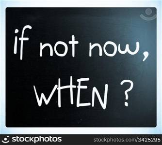 ""If not now, when?" handwritten with white chalk on a blackboard"