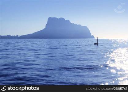 Ifach Penon mountain from Calpe fog backlight floating beacon