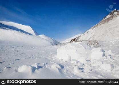 Igloo in a winter mountain setting