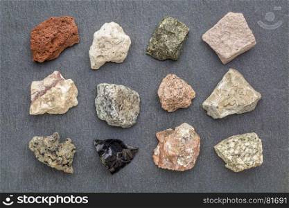 igneous rock geology collection, from top left: scoria, pumice, gabbro, tuff, rhyolite, diorite, granite, andesite, basalt, obsidian, pegmatite, porphyry