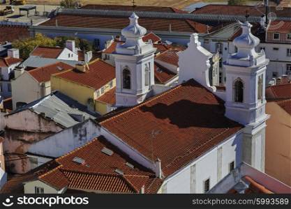Igreja de Santo Estevao in Lisbon and house roofs, Portugal&#xA;