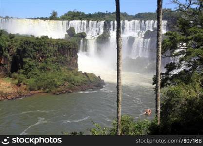 Iguazu falls and red boat in Argentina