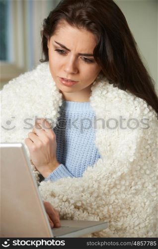 Ill Woman Looking Up Symptoms On Computer