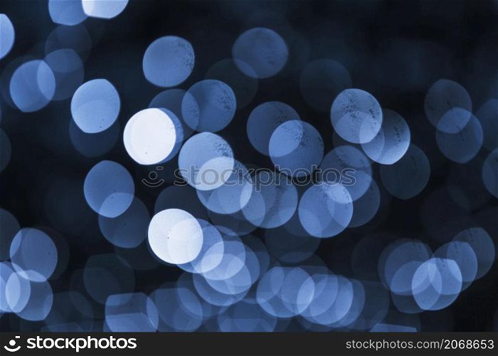 illuminated blue bokeh black background