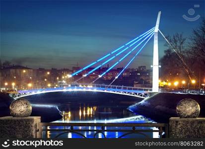Illuminated bridge over the river on the waterfront