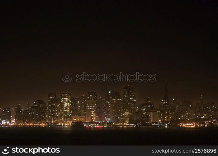 Illuminated buildings at waterfront, California, USA
