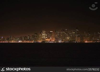 Illuminated buildings at waterfront, California, USA