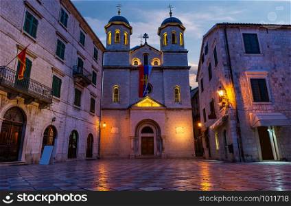 Illuminated Church of Saint Nicholas in Old Town of Kotor at sunrise, Montenegro. Church of Saint Nicholas