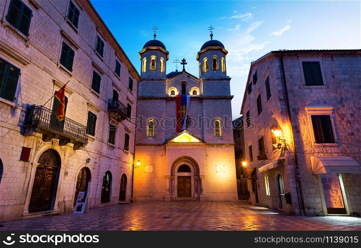 Illuminated Church of Saint Nicholas in Old Town of Kotor at sunrise, Montenegro