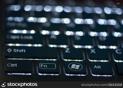 Illuminated keyboard. Focus on Ctrl Fn Alt keys. Shallow depth of field