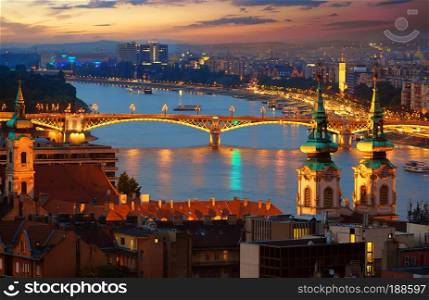Illuminated Margaret Bridge on Danube river in Budapest