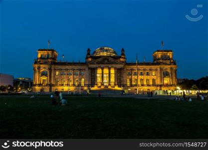 Illuminated Reichstag building in Berlin, Germany at night