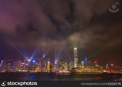 Illuminated skyscrapers along the waterfront of Hong Kong, China