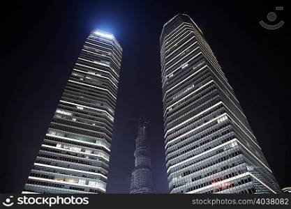 Illuminated skyscrapers at night, Shanghai, China