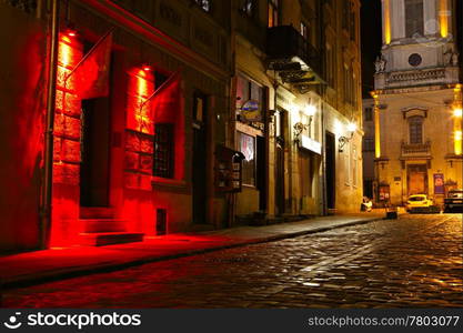 illuminated street at night. Old european city