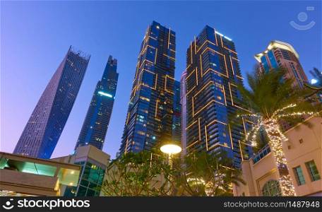 Illuminated towers of Dubai Marina district at night, United Arab Emirates