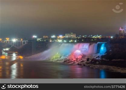 Illumination light of american Falls as viewed from Table Rock in Queen Victoria Park in Niagara Falls at night, Ontario, Canada