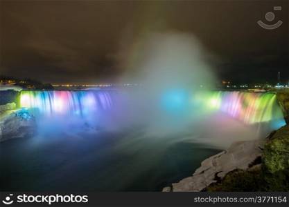 Illumination light of Horseshoe Falls as viewed from Table Rock in Queen Victoria Park in Niagara Falls at night, Ontario, Canada