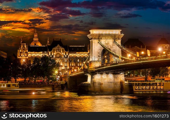 Illumination of Chain Bridge in Budapest at cloudy evening