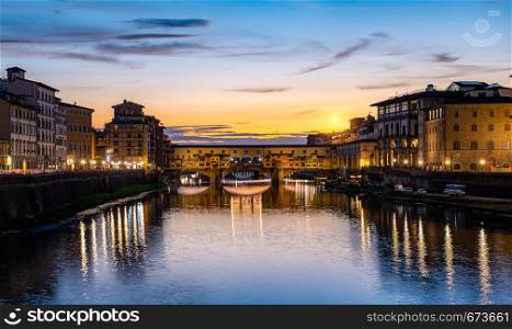 Illumination on Ponte Vecchio at early sunrise in Florence