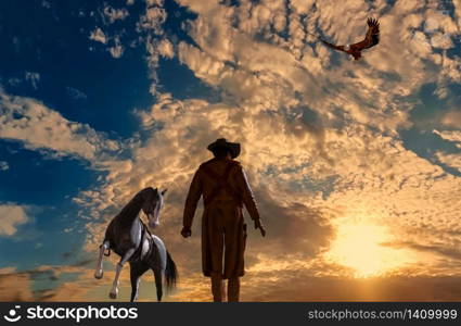 Illustration of a cowboy at sunset background with an eagle and a horse - 3d rendering. Cowboy at sunset background with an eagle and a horse