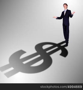 Image of a business man with a shadow shaped as a currency sign