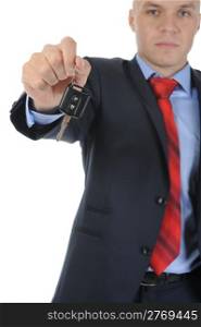 Image of a businessman gives the keys to the car. Isolated on white