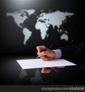 Image of a businessman hand signing documents