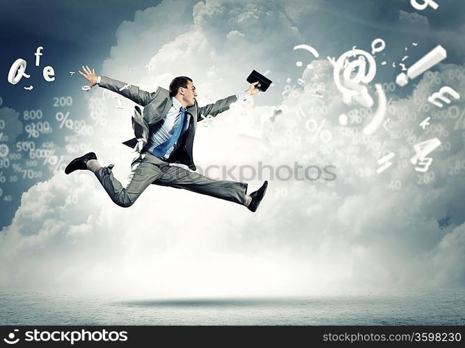 Image of a businessman jumping high against blue sky background