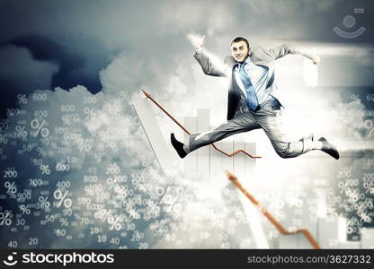 Image of a businessman jumping high against blue sky background