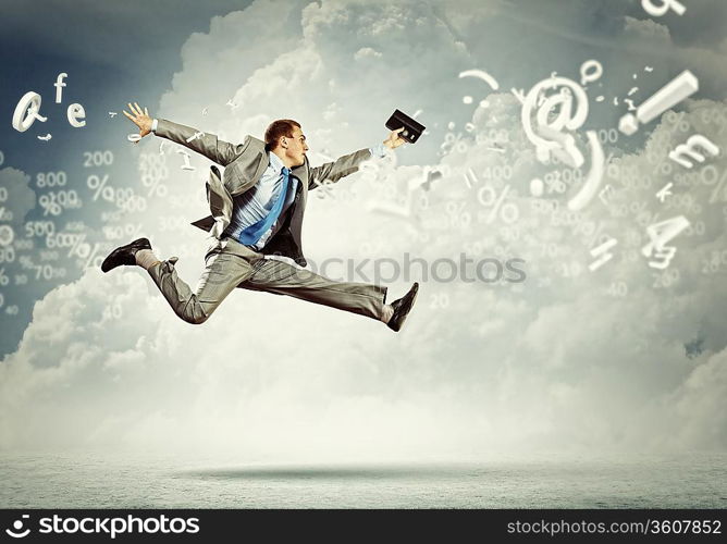 Image of a businessman jumping high against financial background