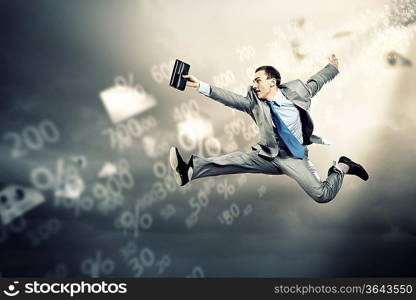 Image of a businessman jumping high against financial background