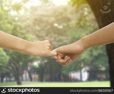 Image of a couple holding hands in a park